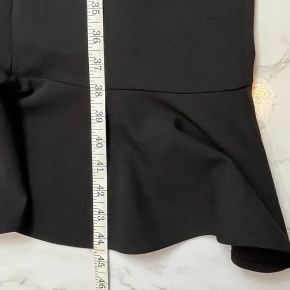 Calvin Klein Black sleeveless stretch crepe dress with ruffle hem, size 4